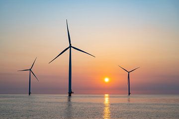 Wind turbines in an offshore wind park producing electricity dur by Sjoerd van der Wal