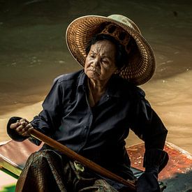 Elderly woman in floating market Chiang Mai by Nick van der Blom