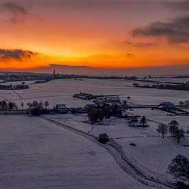Sunset in snowy southern Limburg by John Kreukniet