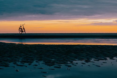 Beautiful sunset Katwijk with bicycle