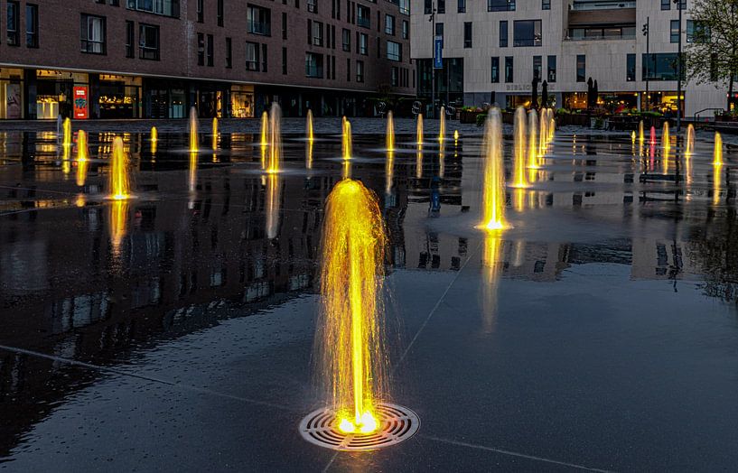 Kapellen village square with colourful fountains. by Bruno Hermans