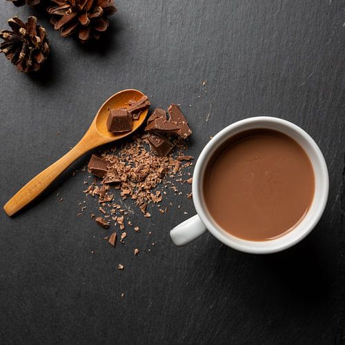flat lay of a cup of chocolate milk