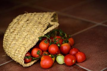 Tomatoes in basket by Ulrike Leone