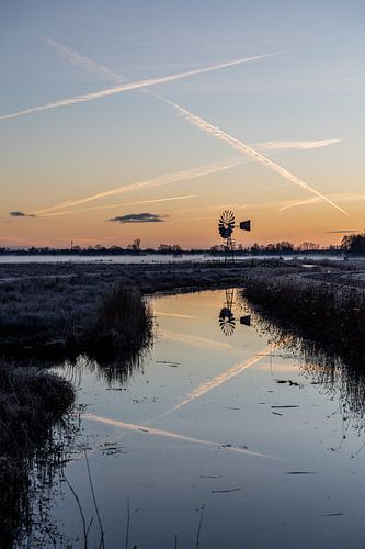 A small windmill at sunrise