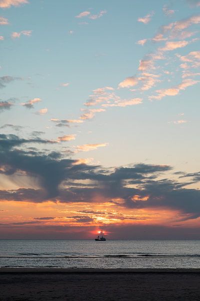 Sunset over the sea with boat. by Amber den Oudsten