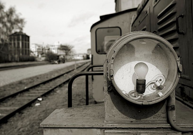 Headlight with bulb of an old decommissioned locomotive by Heiko Kueverling