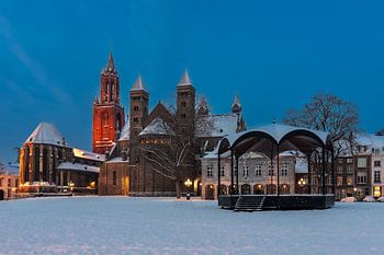 Saint Servatius basilica during blue hour with snow-covered vrijthof