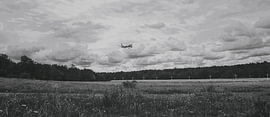 An airplane into a black and white atmosphere by Armanto Brouka