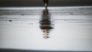 Reflection at the beach by Alex Hamstra