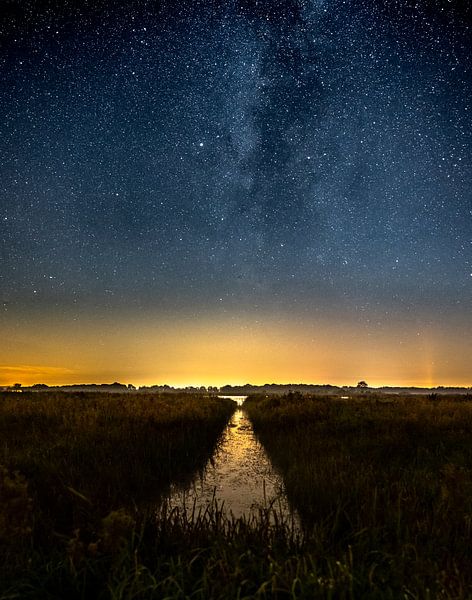 The Milky Way as seen from the Leekstermeer overlooking the water. by Hessel de Jong