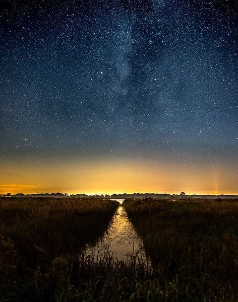 The Milky Way as seen from the Leekstermeer overlooking the water. by Hessel de Jong Fotografie
