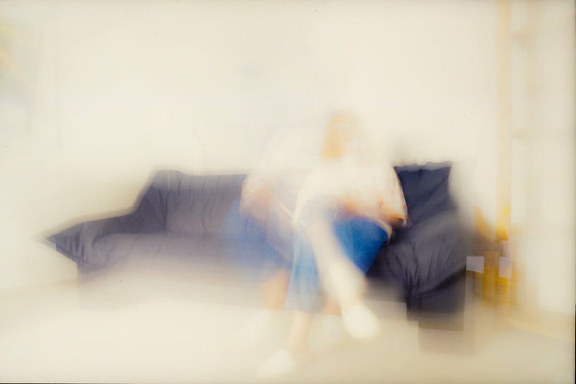 Woman on sofa by Dieter Walther