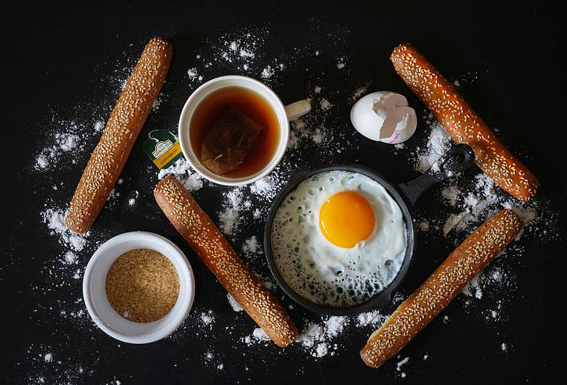 Still life with fried egg, tea and bread. by Saskia Dingemans Awarded Photographer