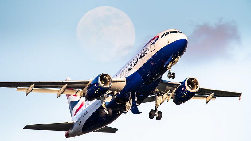 Plane along the moon by Dennis Janssen