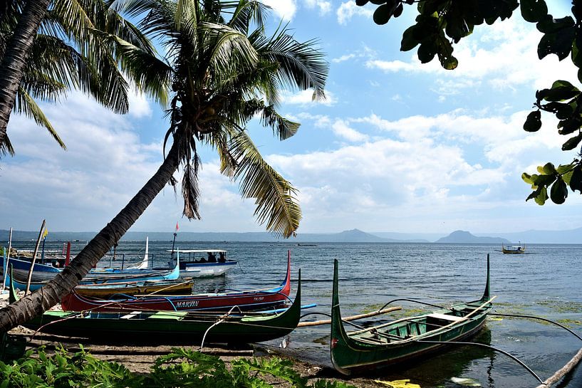Traditional boats in front of the Taal volcano by Frank Photos