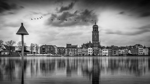 Black and white sculpture of Deventer and the IJssel during high tide with reflection in the water.