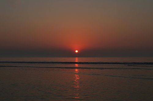 zonsondergang strand
