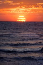 Sunset Paints the Ocean Horizon in Golden Hues Over Tranquil Wav by PhotoCluster