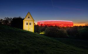 Allianz Arena, Munich, with the church on Müllberg