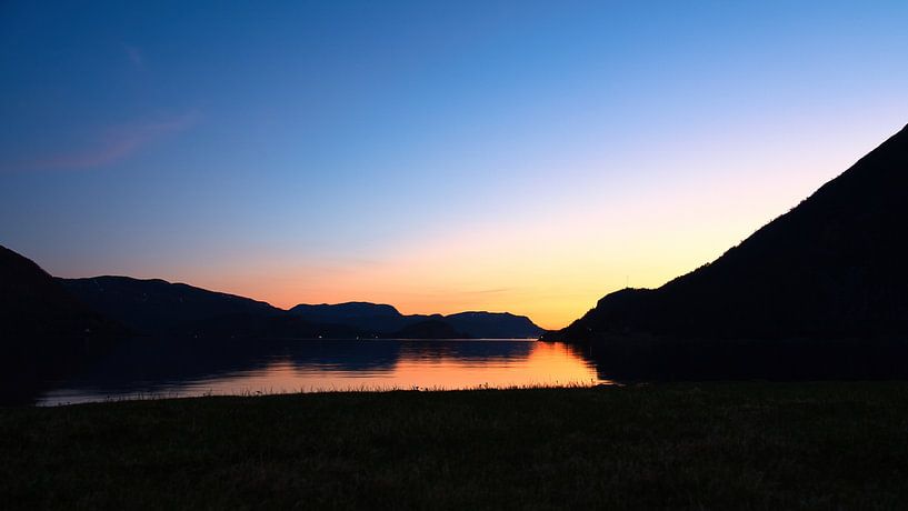 Fjord and sea in Norway at the blue hour by Martin Köbsch