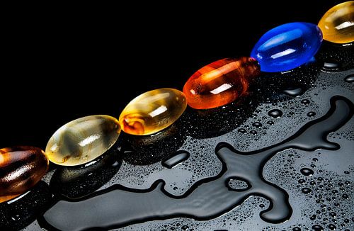 six stones of glass with water