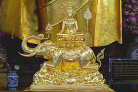 Golden Goddess above the elephant
