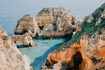 Fisherman among the cliffs of Ponta da Piedade by Rachel Mein