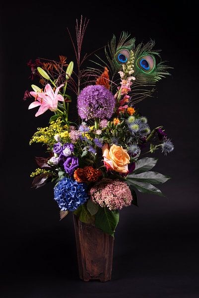 A soothing bouquet of flowers with 2 peacock feathers by Marjolijn van den Berg