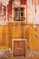 Old wall in ochre and red.