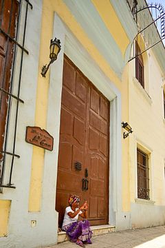 The Cuban woman with a Cuban cigar. by Theo Groote