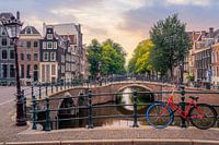 A red bicycle on the Keizersgracht in Amsterdam