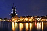 Windmill De Adriaan in Haarlem reflects in the water