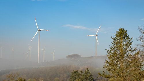Windwheels in the German Eifel in the morning fog - Summer Energy