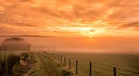 Mistige zonsopkomst in de buurt van Epen in Zuid-Limburg van John Kreukniet thumbnail