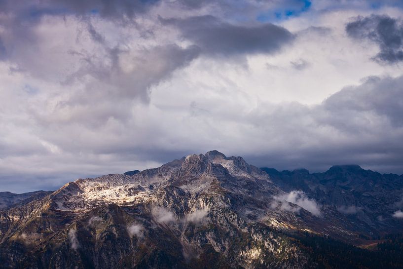 Top of the rocky mountain and menacing clouds. extreme symbol. by Michael Semenov