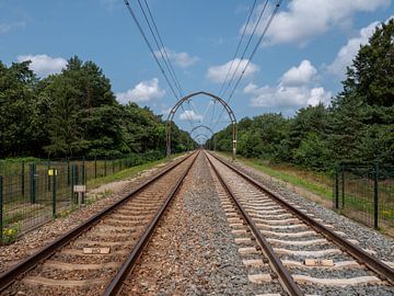 Symmetrical railway track with unique monumental overhead wires in arch form by Robin Jongerden