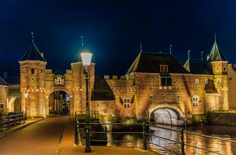 Koppelpoort in amersfoort in the evening by peterheinspictures