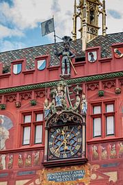 Picture and clock on Basel Town Hall in Switzerland by Joost Adriaanse