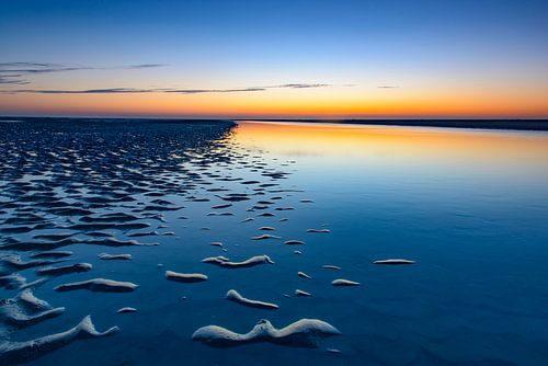 Schiermonnikoog zonsondergang op het strand