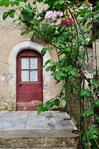 Old Red Door in Saint-Cirq-Lapopie, Lot - Medieval Charm and Vegetation