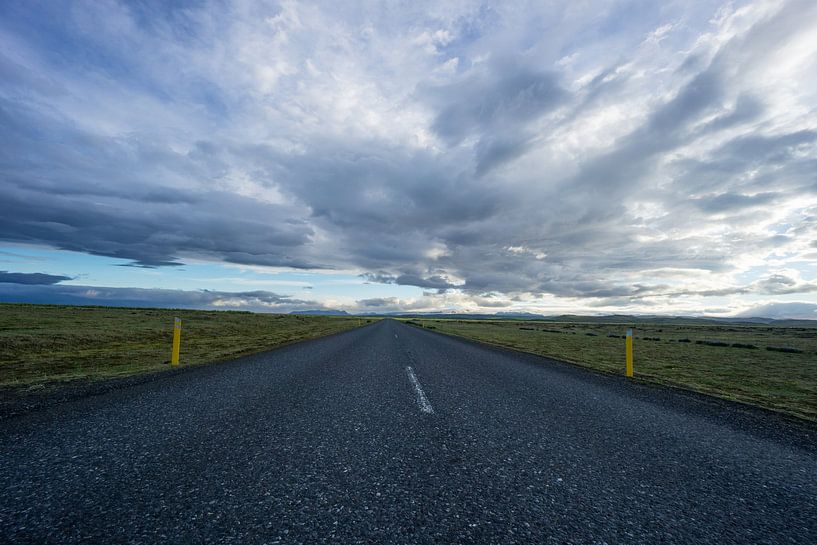 Iceland - Bolt upright street between wide green land and mountains by adventure-photos