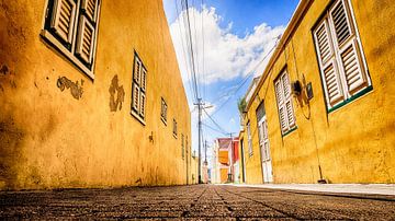 yellow alley in curacao by marloes voogsgeerd