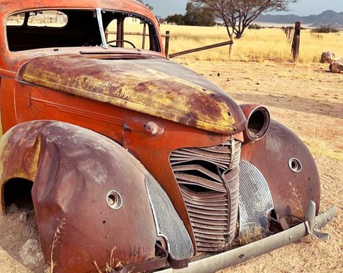 an American classic car wreck in the desert