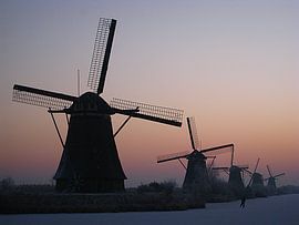 Mill with a lonely skater in Kinderdijk Holland