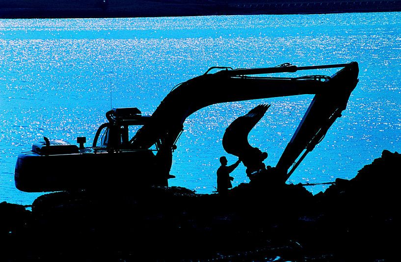 Crane operator performs maintenance at the end of the day. by Nico Orie