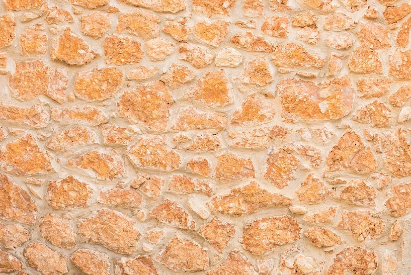 Structure de fond d'un mur en pierre naturelle, gros plan par Alex Winter