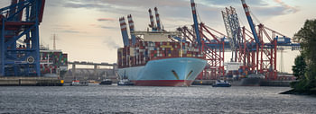 Large container ship departs from the port of Hamburg