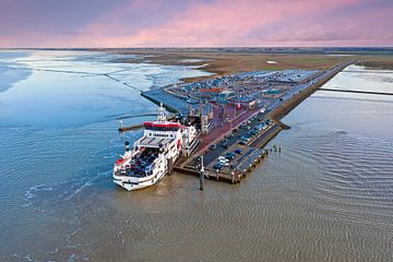 Aerial view of the ferry to Ameland arriving at Holwerd in Friesland Netherlands at sunset by Eye on You