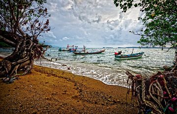 dark clouds above fishing boats at the beach of Koh Samui, Thailand