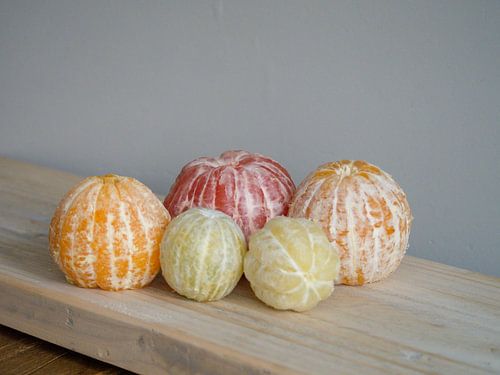Variation on fruit still life, with peeled citrus fruit.